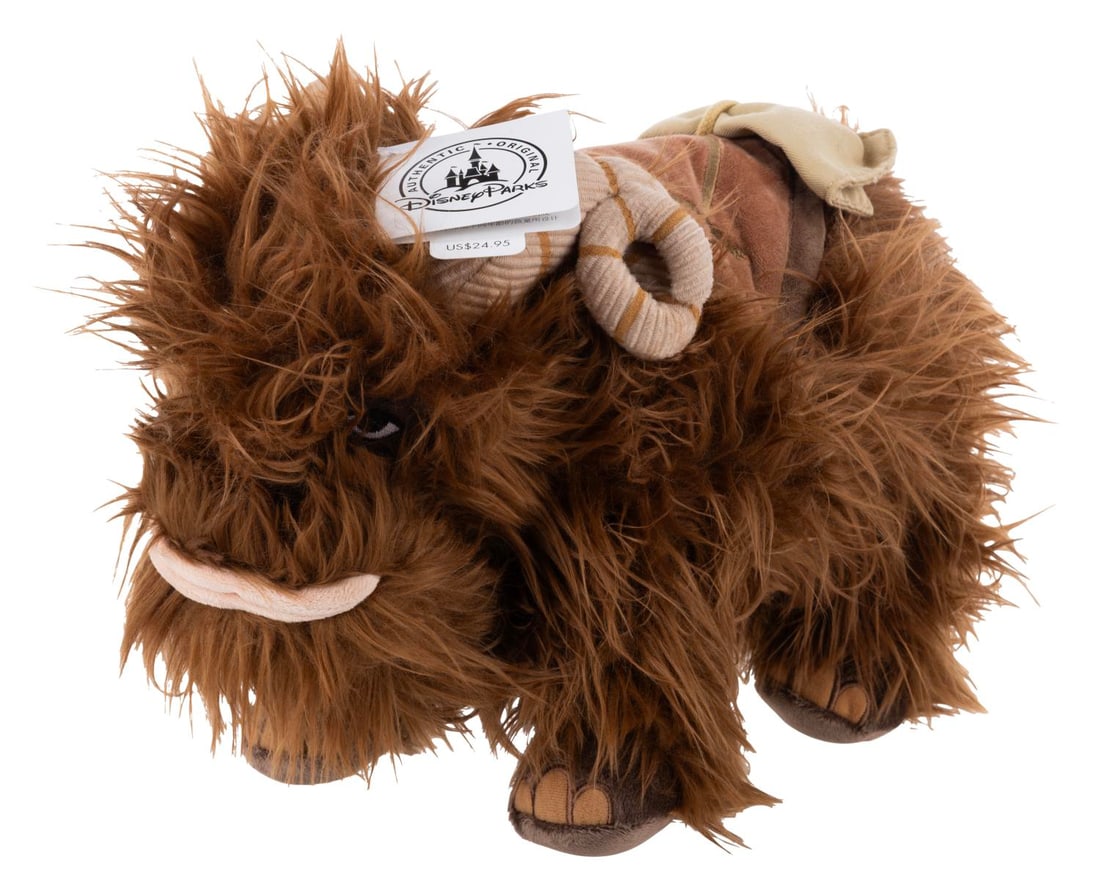A Disney Parks Bantha Plush.: (Disney Parks, 2014) A plush Bantha sold in the Disney Parks early after the aquisition of Lucasfilm. Measuring 22" long, the plush is in fine condition.