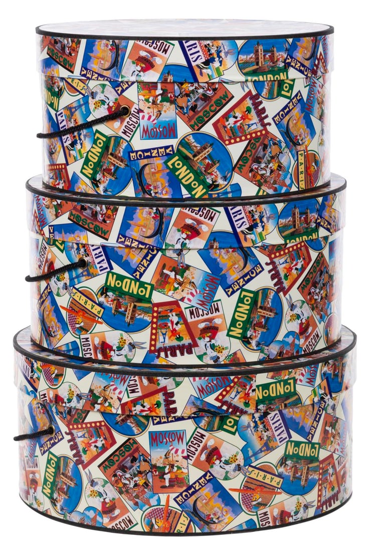 A Trio of Nesting Looney Tunes Hatboxes.: (Warner Bros., 1993) A set of three nesting hatboxes, originally sold at the Warner Bros. Studio Stores. The design recreates travel decals to feature Warner cartoon characters. Measuring from 11"