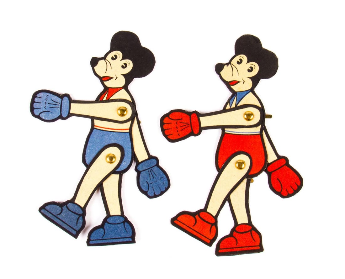 A Pair of Unusual Mickey Mouse Jointed Cut-Outs.: (Disney, 1930s-70s) Two very unusual paper cut-out figures of Mickey Mouse, jointed with brass brads at the shoulders and hips. With a vaguely European style, these may be well-preserved old pieces or