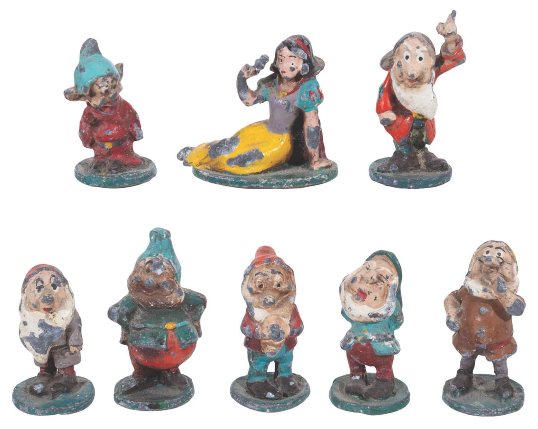 A Rare Set of "Snow White and the Seven Dwarfs" Metal Figurines.: (1930s-50s) A rare collection of eight hand-painted metal "Snow White and the Seven Dwarfs" figurines. Ranging in size from 1.5" to 2" tall, the metal figurines are in fair condition with heavy paint 