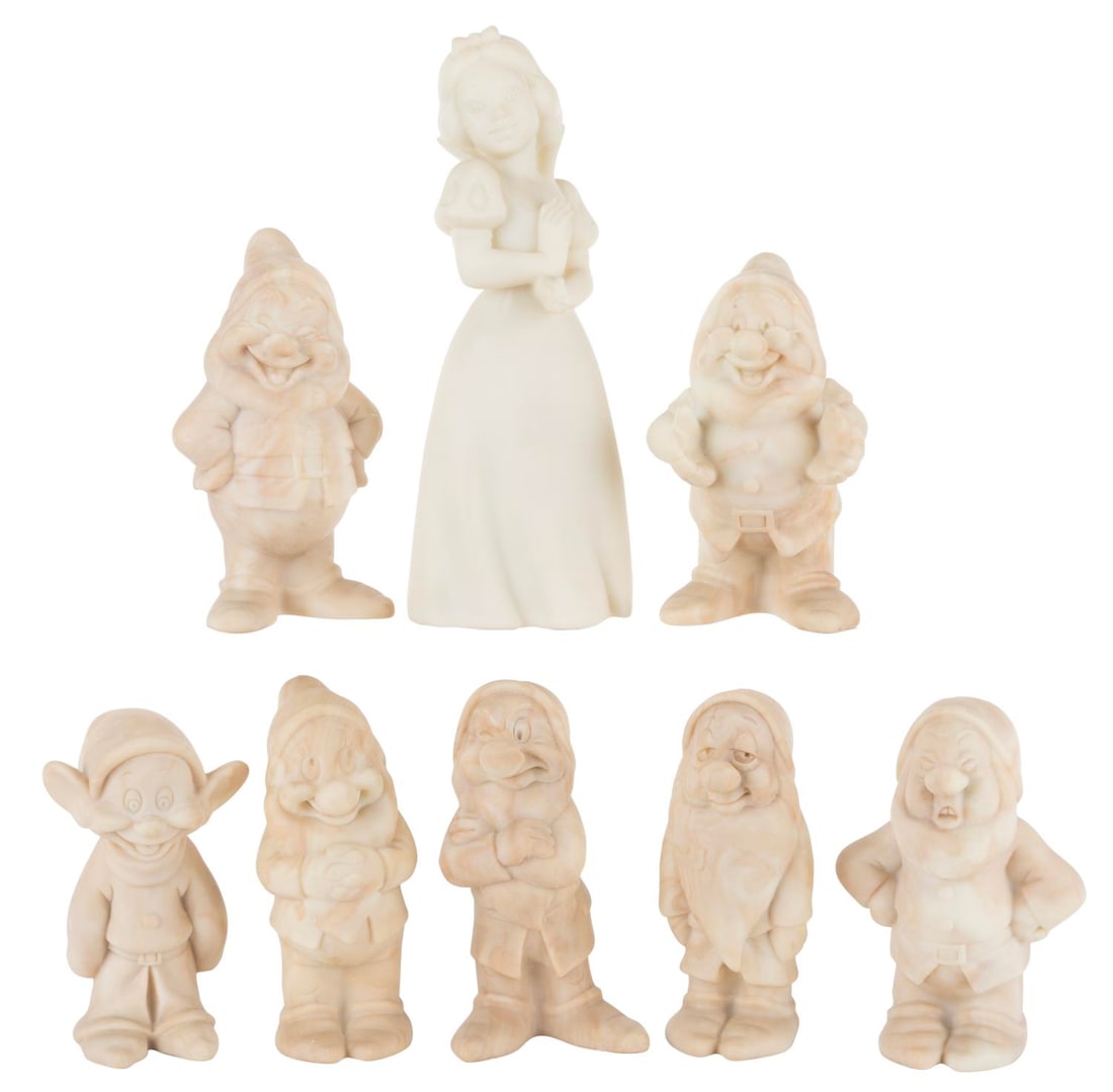 A "Snow White and the Seven Dwarfs" Cameonyx Set.: (Stonequarry, 1980s) A set of eight "Snow White and the Seven Dwarfs" figurines made out of cameonyx, a man-made material combining resin and ground stone that resembles marble. Ranging in size from 6