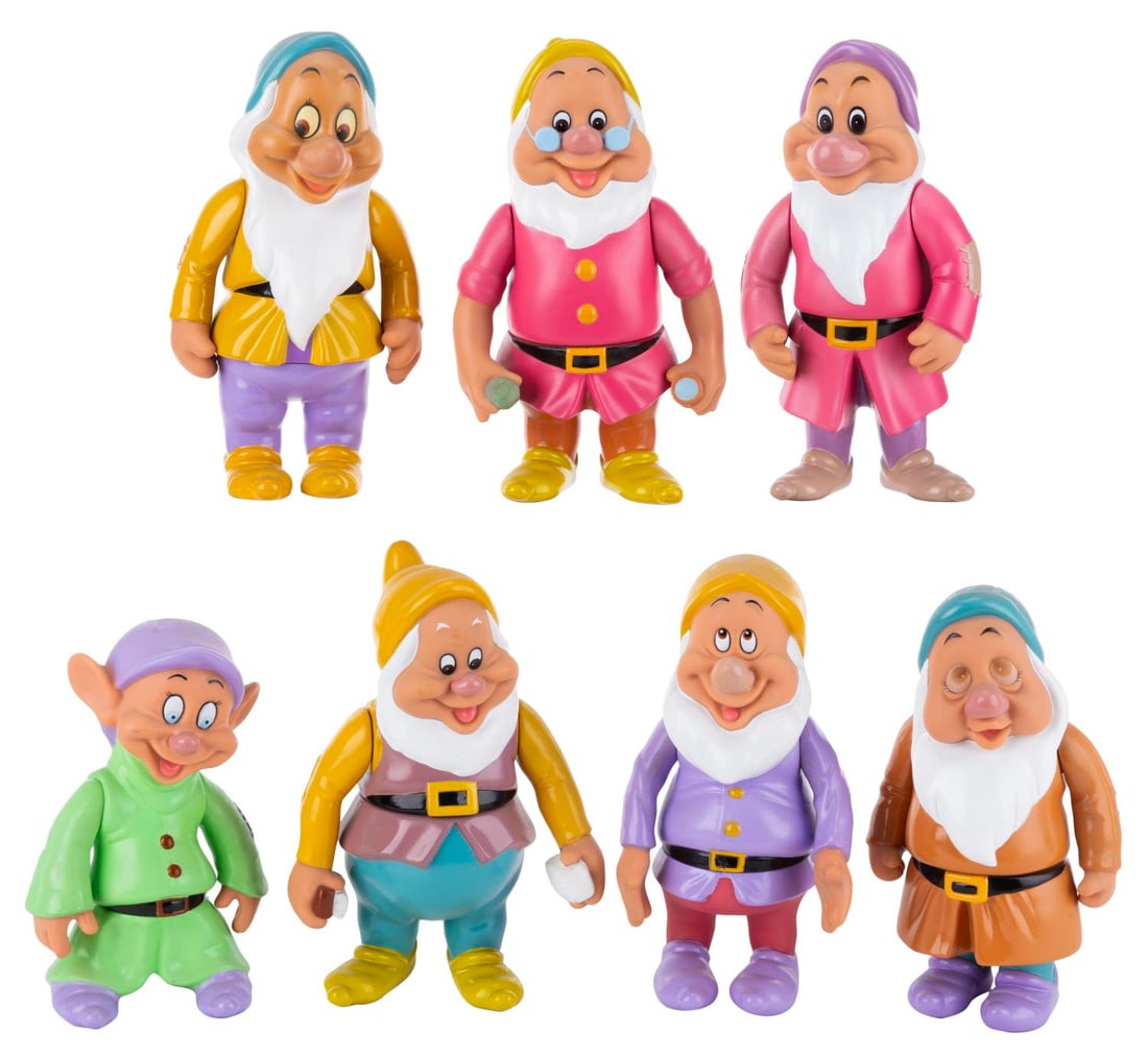 A "Snow White and the Seven Dwarfs" Figurine Set.: (Disney, 1990s-2000s) A set of seven figurines of each Dwarf from "Snow White and the Seven Dwarfs" with moveable arms, made in China. Measuring 5.5" to 6.5" tall, the figurines are in good to very go