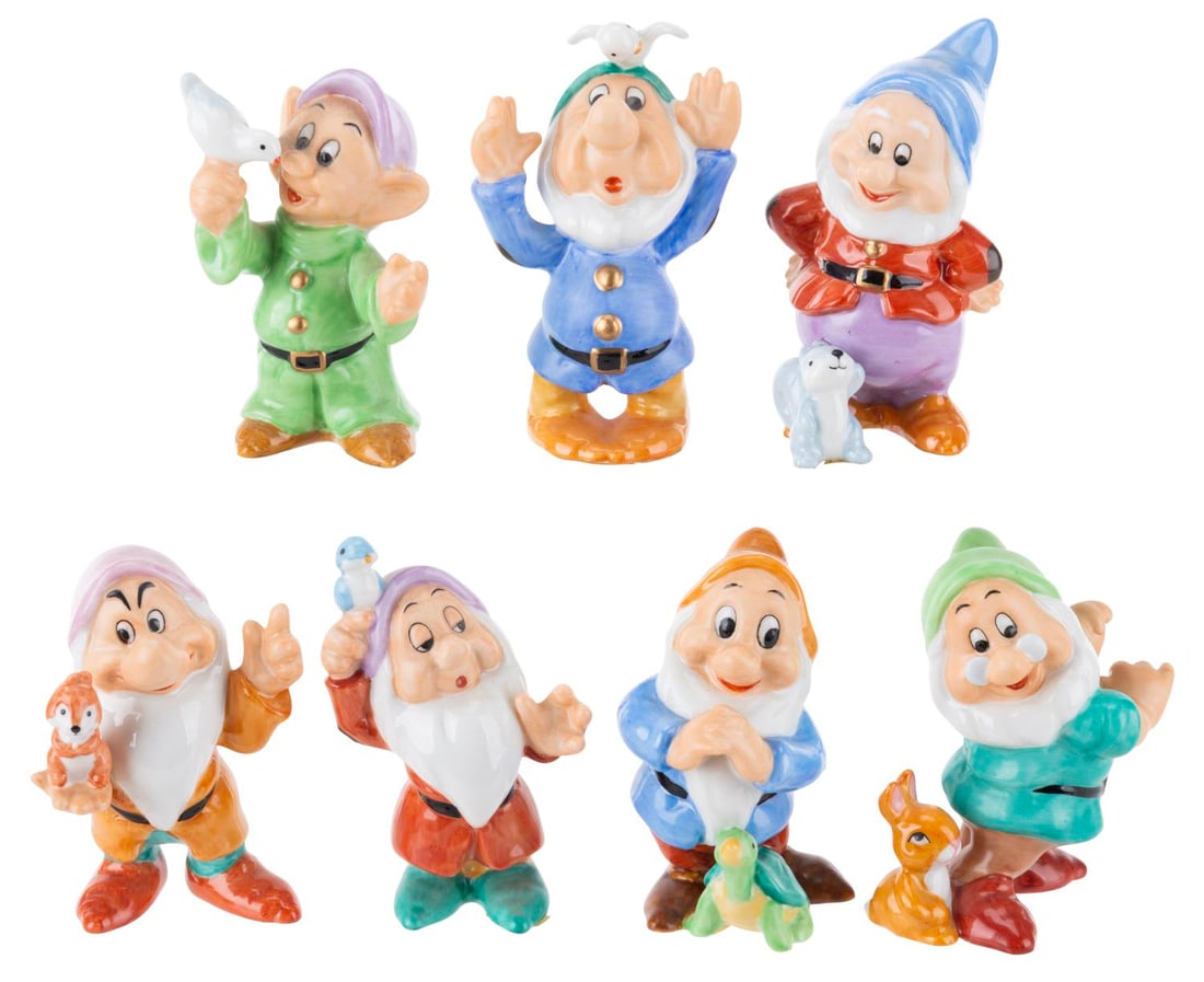 A "Snow White and the Seven Dwarfs" Ceramic Figure Set.: (Disney, 1990s-2000s) A seven-piece ceramic figurine set of each Dwarf from "Snow White and the Seven Dwarfs." Measuring 2.5" to 2.75" tall, the figurines are in very good condition with light soiling