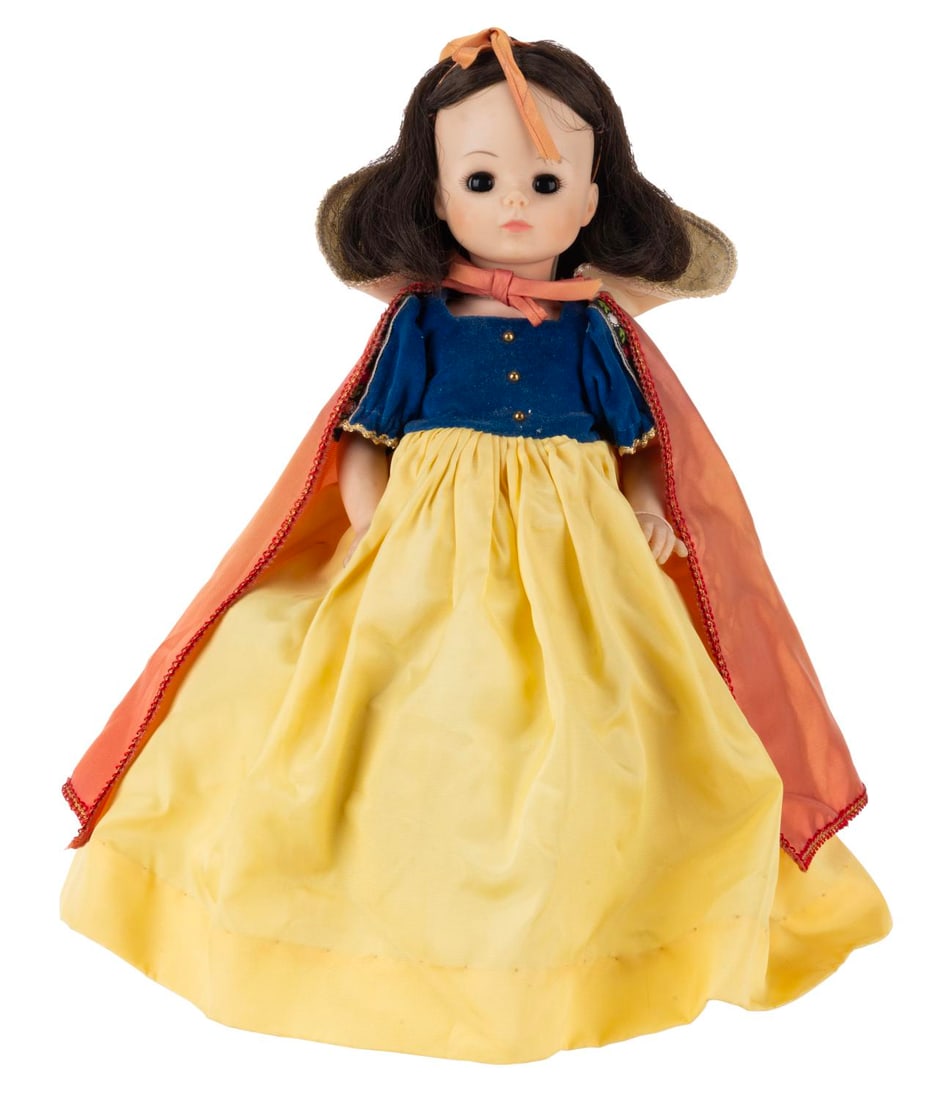 A "Snow White" Doll by Madame Alexander.: (Madame Alexander, 1970s) A "Snow White and the Seven Dwarfs" doll manufactured by Madame Alexander. Measuring 13" tall, the doll displays in very good condition with light wear and discoloration from