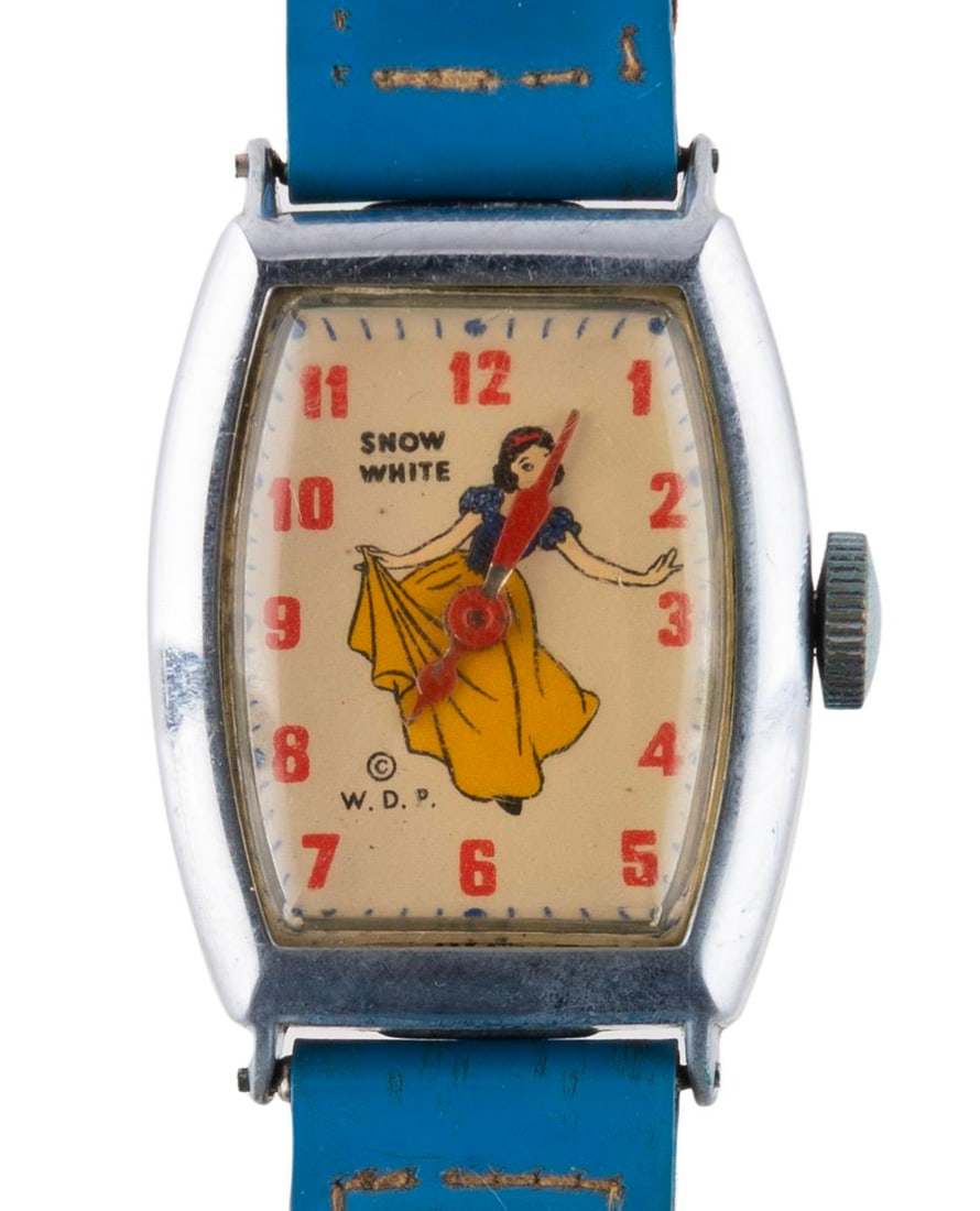 A U.S. Time "Snow White" Wristwatch.: (U.S. Time, 1940s) An original U.S. Time Snow White wristwatch. Displaying in very good condition with light wear to te band, the watch functioned when tested.