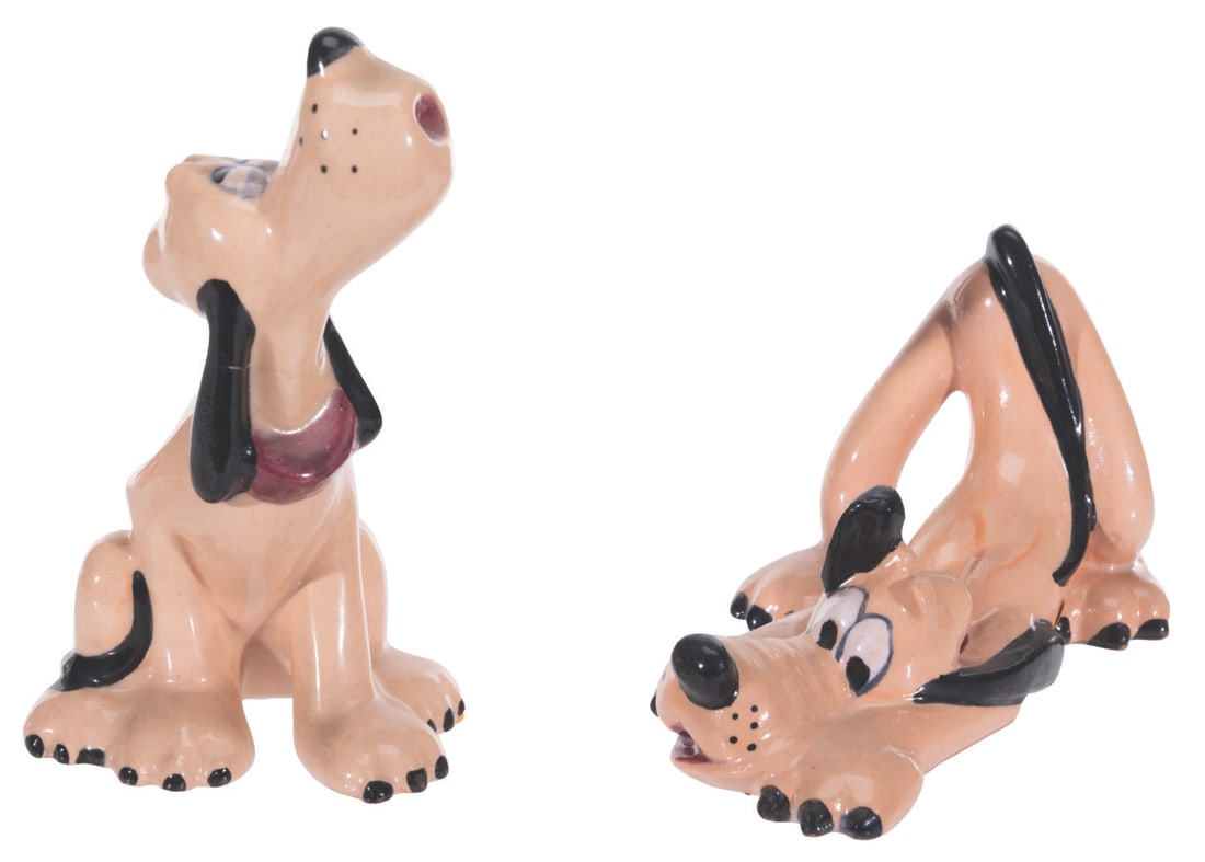A Pair of Pluto Figurines by Brayton Laguna.: (Brayton Laguna, 1938) A pair of ceramic figurines of Pluto manufactured by Brayton Laguna. The ceramics manufacturer was the first in California to have a licence to produce Disney character pieces.