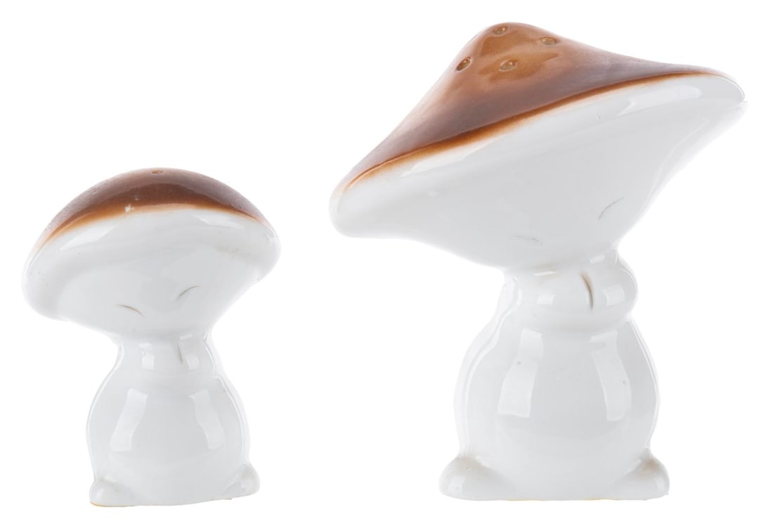 A Pair of "Fantasia" Mushroom Salt & Pepper Shakers.: (Disney, 1970s-80s) A pair of dancing mushroom salt and pepper shakers inspired by the Nutcracker Suite sequence of "Fantasia." Measuring 2.75" to 3.75" tall, the shakers are in good condition with li