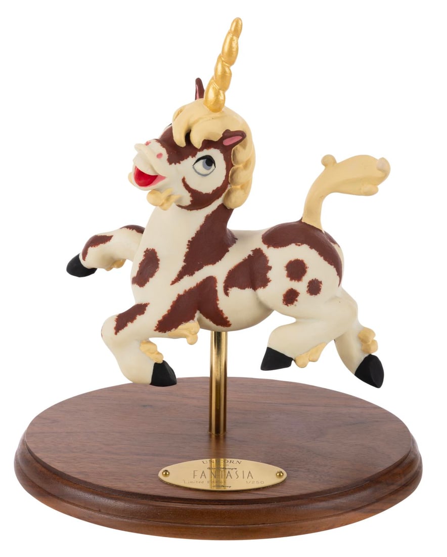 A "Fantasia" Unicorn Maquette Replica.: (Disney, 1990s) A resin replica of the animator's maquette used for unicorns during production of "Fantasia," based on the original mold. The unicorn is displayed atop a wooden base with a plaque read