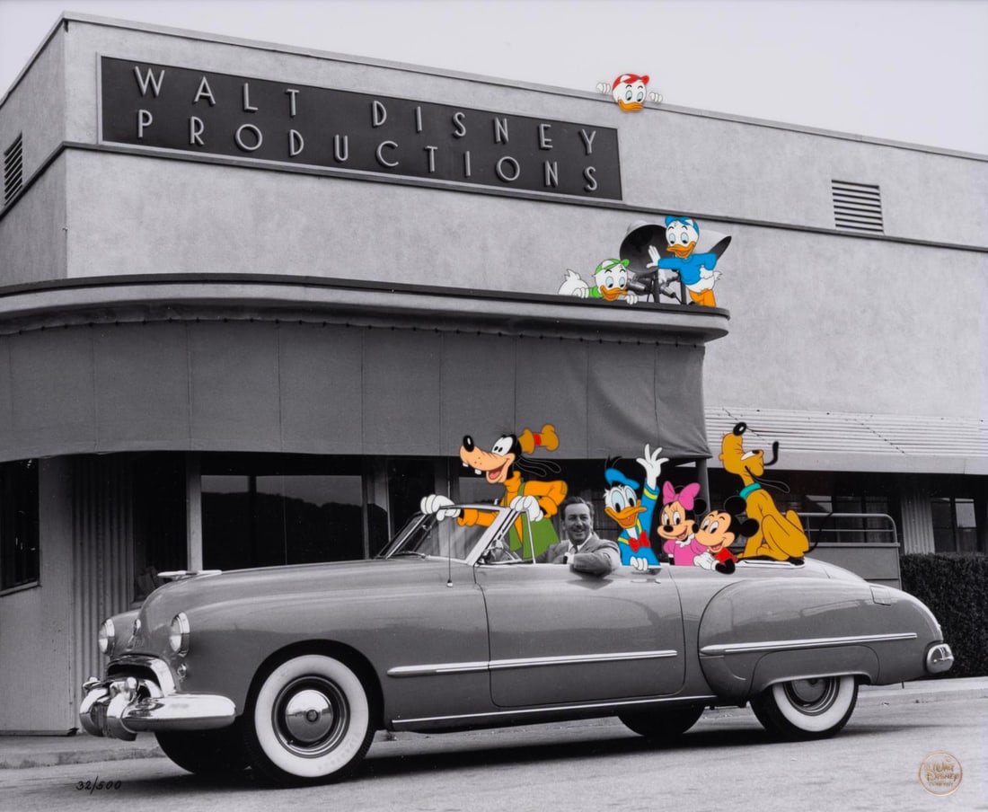 A "Walt's Convertible" Hand-Painted Limited Edition Cel.: (Disney, 1992) A hand-painted limited edition cel featuring a photograph of Walt Disney taken in 1948 paired with a cel layer of several Disney characters. The cel was released in an edition of 500 pi