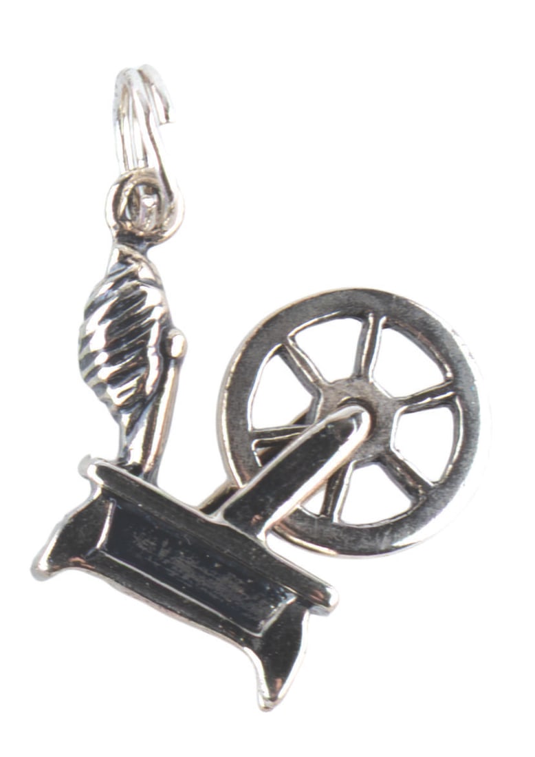 A WDCC "Sleeping Beauty" Spinning Wheel Charm.: (WDCC, 1990s) A sterling silver spinning wheel charm based on the Walt Disney Classic Collections annual marks and "Sleeping Beauty." Measuring 0.5", the charm is in fine condition.