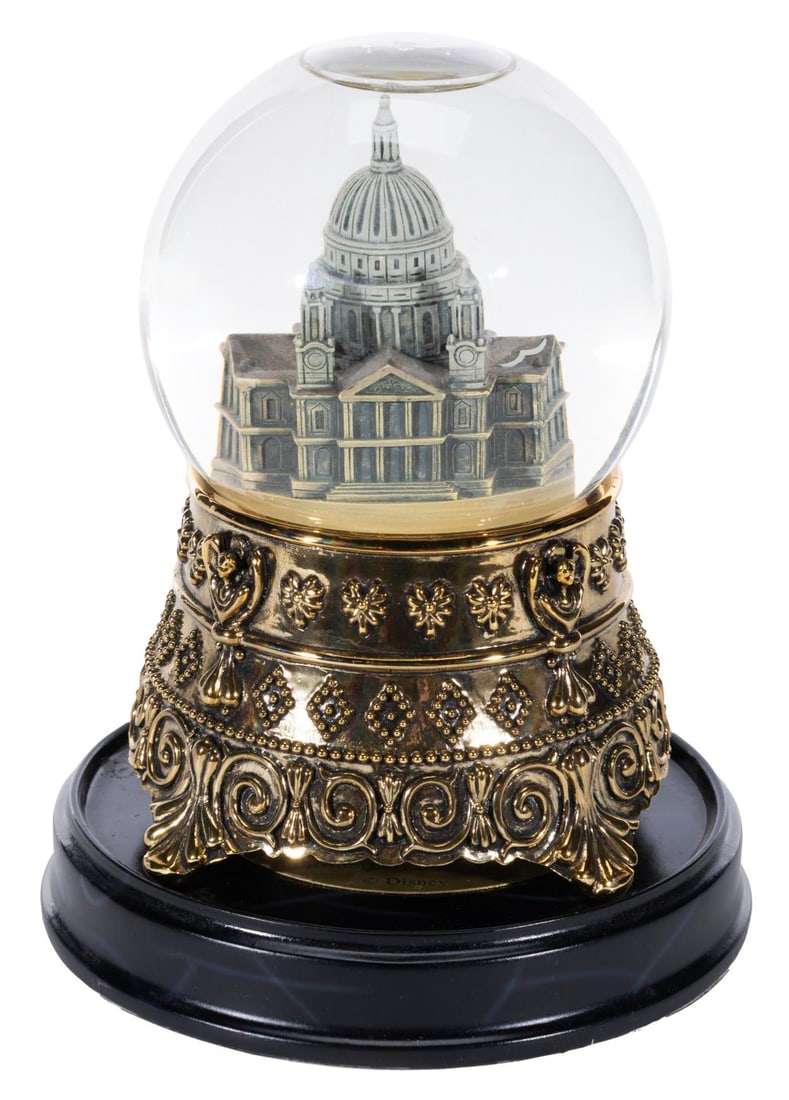 A "Mary Poppins" St. Paul's Cathedral Snowglobe.: (Disney, 1999) A musical snow globe featuring St. Paul's Cathedral as seen in "Mary Poppins," released for the 35th anniversary of the film. When wound, the snow globe plays "Feed the Birds," written 