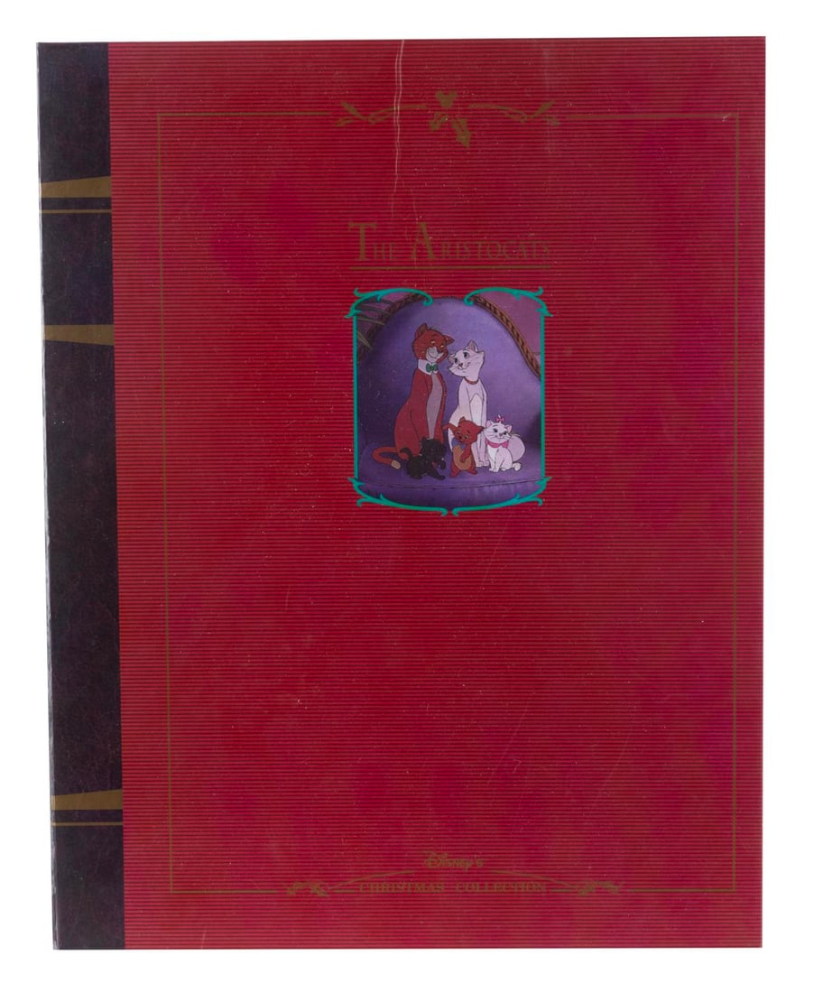 A "The Aristocats" Storybook Christmas Ornament Set.: (Disney, 1990s) A five-piece "The Aristocats" Christmas Ornament set with a storybook-style box. Measuring 3" x 9.25" x 11.75" in the box, the ornaments are in fine condition, while the box exhibits c