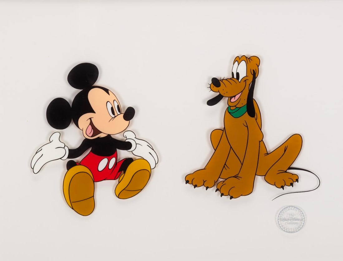 A Mickey & Pluto Framed Sericel.: (Disney, 1990s) A limited edition sericel featuring Mickey Mouse and Pluto. Originally sold at the Disney Store, the framed artwork measures 19" x 16" and still has the Disney Store price sticker on