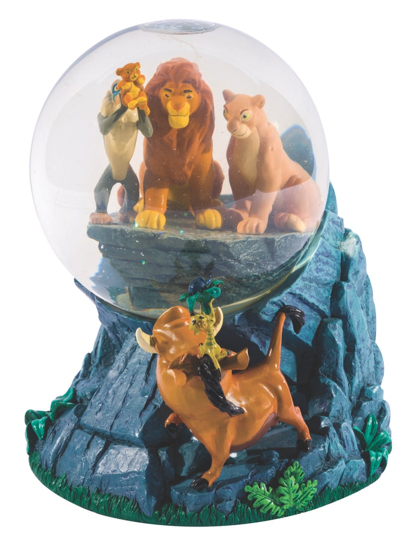 A "The Lion King" Musical Snow Globe.: (Disney Store, 1990s) A musical "The Lion King" snowglobe that plays "Circle of Life" when wound. Measuring 6" diameter x 7" tall, the globe is in very good working condition, with slight