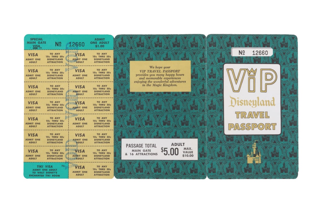 A Disneyland VIP Travel Passport.: (Disneyland, 1960s) An adult VIP Disneyland travel passport, including the full sheet of 16 attraction tickets, stamped "VOID." Measuring 6" x 11.25" open, the passport is numbered 12660 and displays 