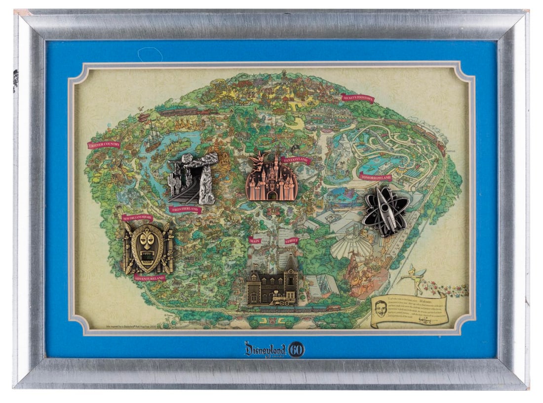 A Disneyland 60th Anniversary Locks of the Kingdom Framed Pin Set.: (Disneyland, 2015) A framed set of five Disneyland 60th Anniversary Locks of the Kingdoms pins. Designed by artist Ximena Romero, the set was released in a limited edition of 300 pieces. The entire