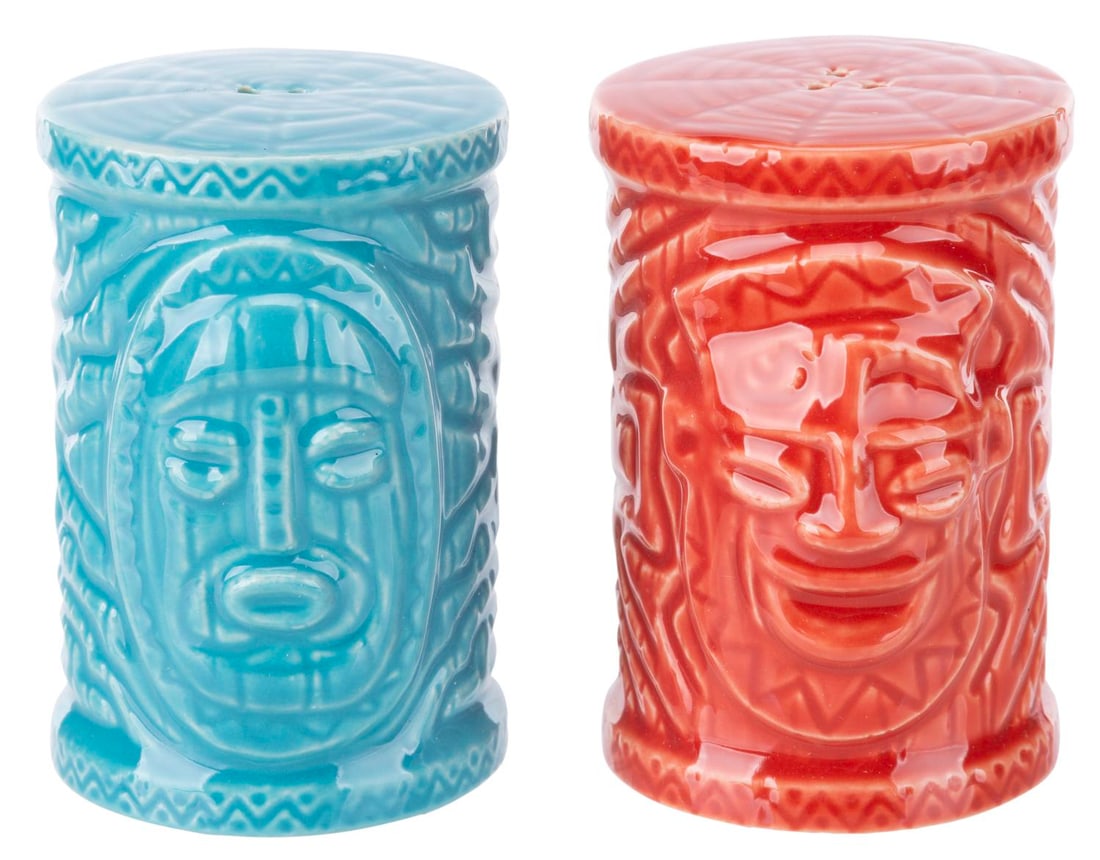 A Pair of Adventureland Salt and Pepper Shakers.: (Disneyland, 2000s) A set of tiki salt and pepper shakers from Adventureland, the home of Walt Disney's Enchanted Tiki Room. Measuring 3" tall and 2" in diameter each, the salt and pepper shakers come