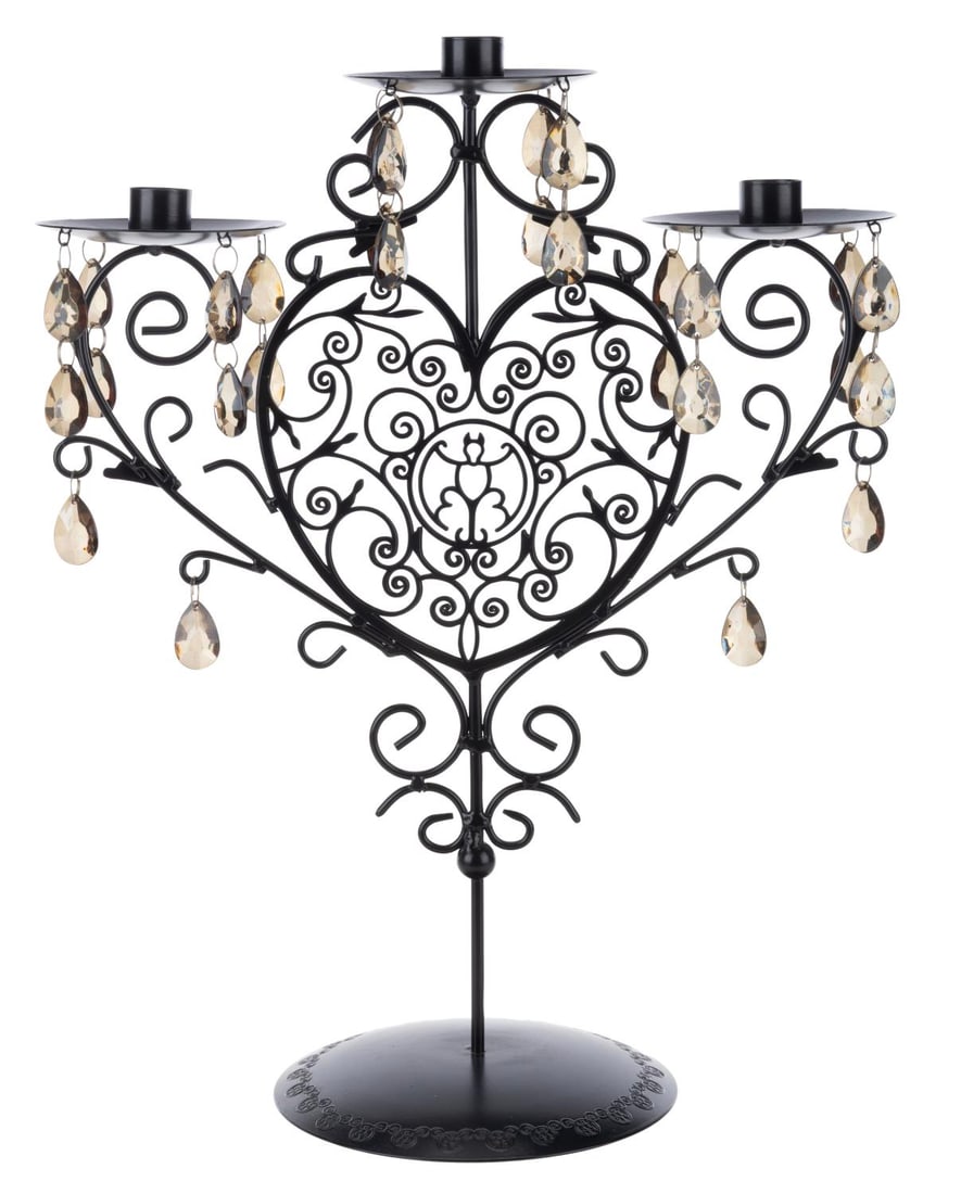 A Haunted Mansion Hidden Mickeys Candle Holder.: (Disney Parks, 2000s/2010s) A metal filigree candleholder with a bat and hidden Mickeys design. Standing 12" x 6" x 15" tall, the piece is in fine condition.