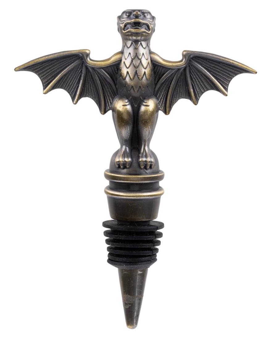 A Haunted Mansion Bat Stanchion Wine Stopper.: (Disney Parks, 2000s) A Haunted Mansion wine bottle stopper based on the attraction's queue stanchions. Measuring 3.5" x 1" x 4.75" tall, the wine stopper displays in very good condition with