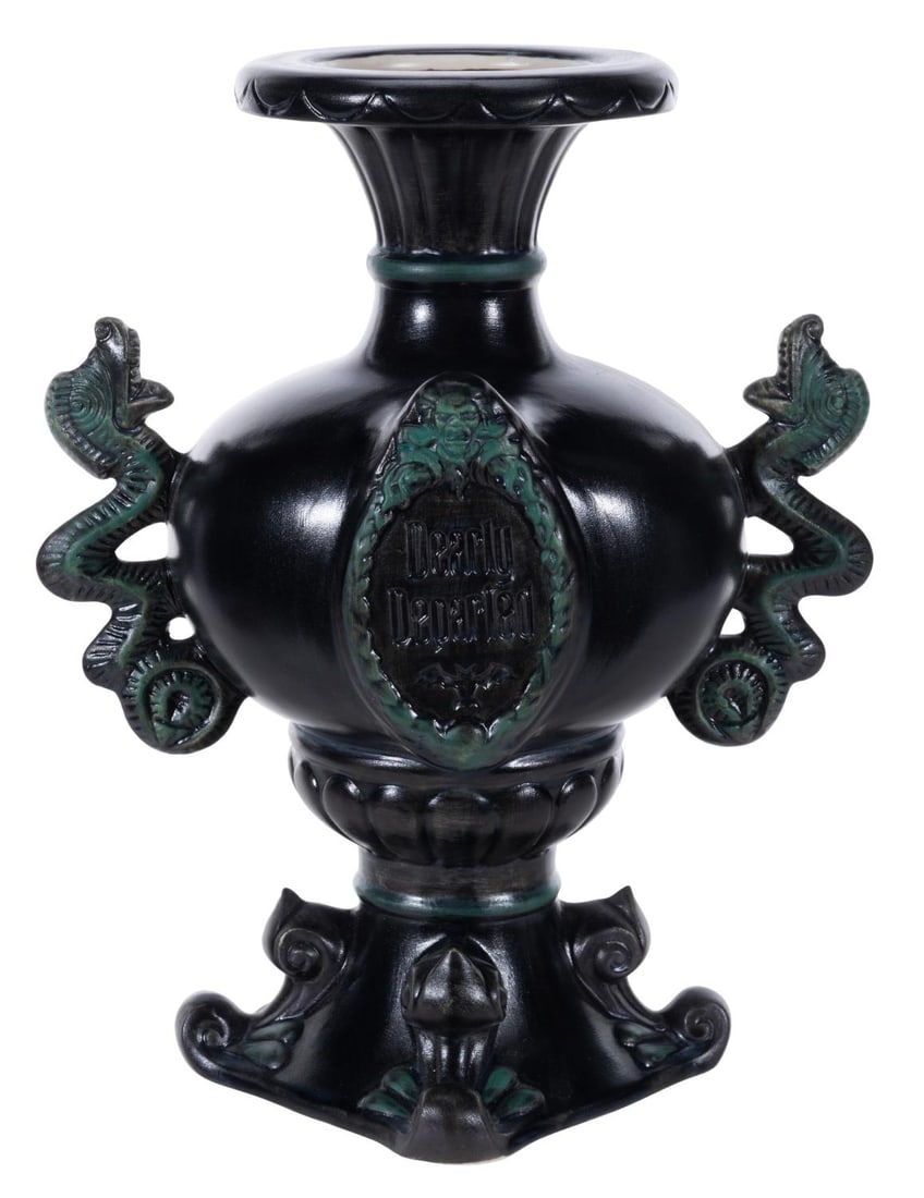 A Haunted Mansion 45th Anniversary Vase.: (Disney Parks, 2014) A Dearly Departed vase, sold exclusively at the Disney Parks for the 45th anniversary of The Haunted Mansion. Measuring 10" tall and 5" in diameter, the vase is in fine condition.