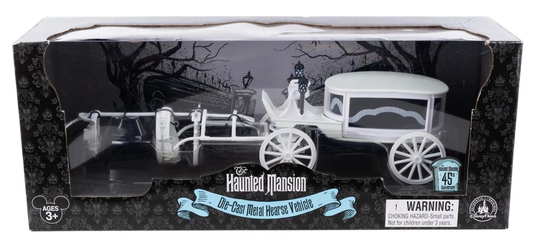 A Haunted Mansion 45th Anniversary Diecast Hearse.: (Disney Parks, 2014) A Diecast metal Haunted Mansion Hearse, released for the 45th anniversary of the attraction. Measuring 10.25" long, the hearse is in fine condition sealed in the original box. The