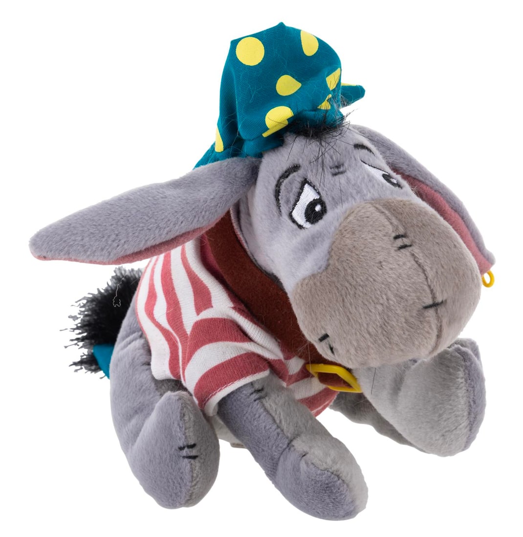 A Pirate Eeyore Bean Bag Plush.: (Disney Parks, 1990s) A bean bag plush of Eeyore dressed as a pirate. The plush is in very good condition with light wear from display.