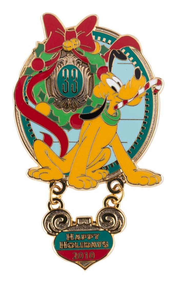 A Club 33 Happy Holidays 2010 Pin.: (Disneyland, 2010) A Happy Holidays dangle pin featuring Pluto, available only to Guests at the exclusive Club 33. The pin is in fine condition.