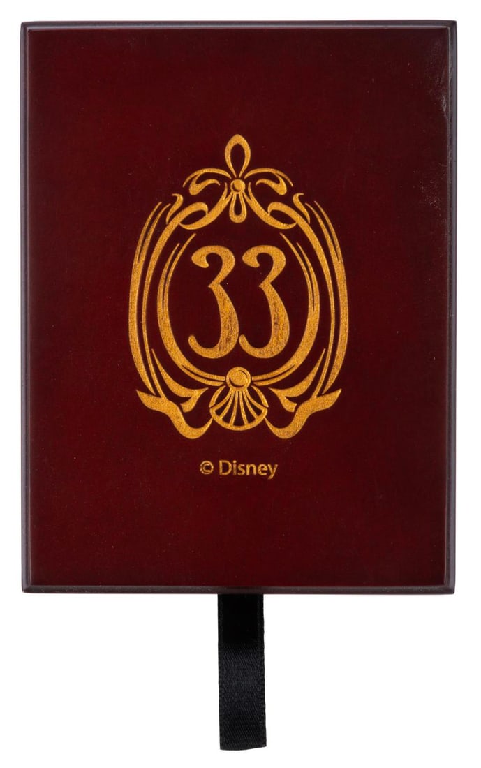 A Set of Club 33 Playing Cards with Wooden Box.: (Disneyland, 2010s) An unopened set of Club 33 playing cards with a custom box available exclusively to members. The shrink-wrapped cards and wooden box feature the updated Club 33 logo from 2014. Mea