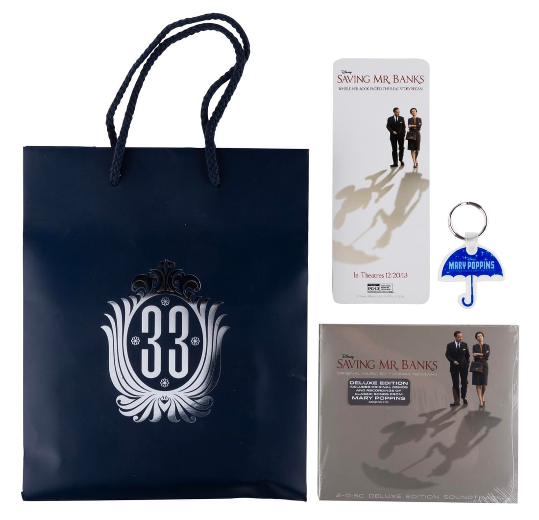 A Club 33 "Mary Poppins" & "Saving Mr. Banks" Promo Bag.: (Disneyland, 2013) A Club 33 gift bag with a sealed "Saving Mr. Banks" CD soundtrack, a "Mary Poppins" 50th Anniversary Edition umbrella keychain, and a double-sided bookmark promoting both films. Ran