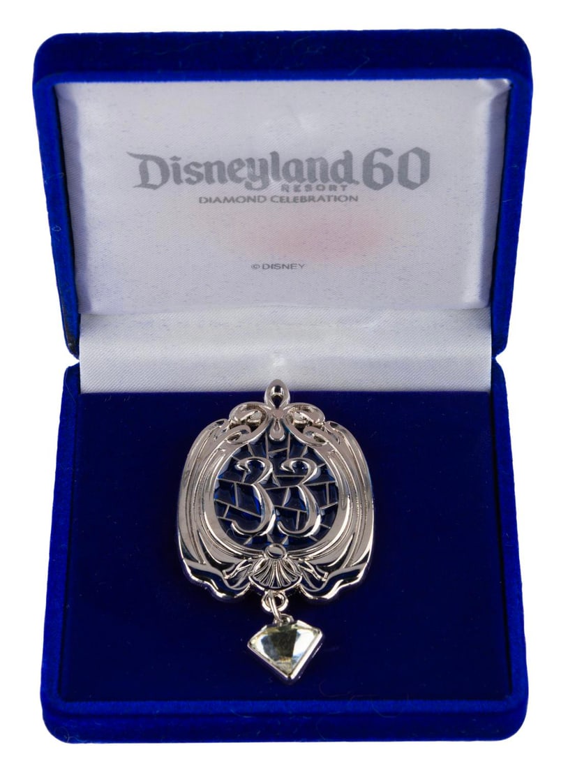 A Club 33 Disneyland Diamond Celebration Pin.: (Disneyland, 2015) A Club 33 pin from Disneyland's 60th anniversary Diamond Celebration, exclusively sold at the members-only establishment in New Orleans Square. Measuring 1.5" x 2.75", the pin comes