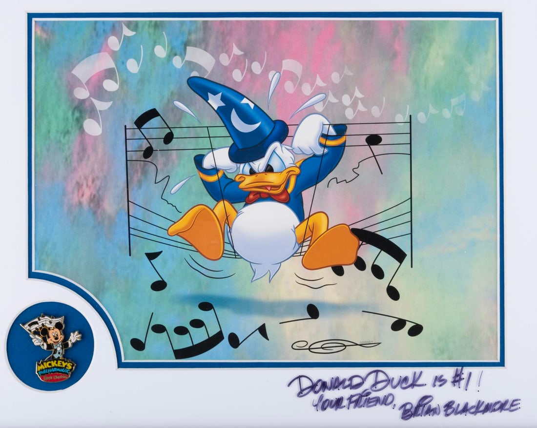 A "Mickey's Philharmagic" Donald Duck Artwork with Mickey Mouse Pin.: (Disney Design Group, 2003) A framed limited edition lithograph and pin celebrating Mickey's Philharmagic. The framed art and pin were limited to production in 2003 and are in their original frame wit