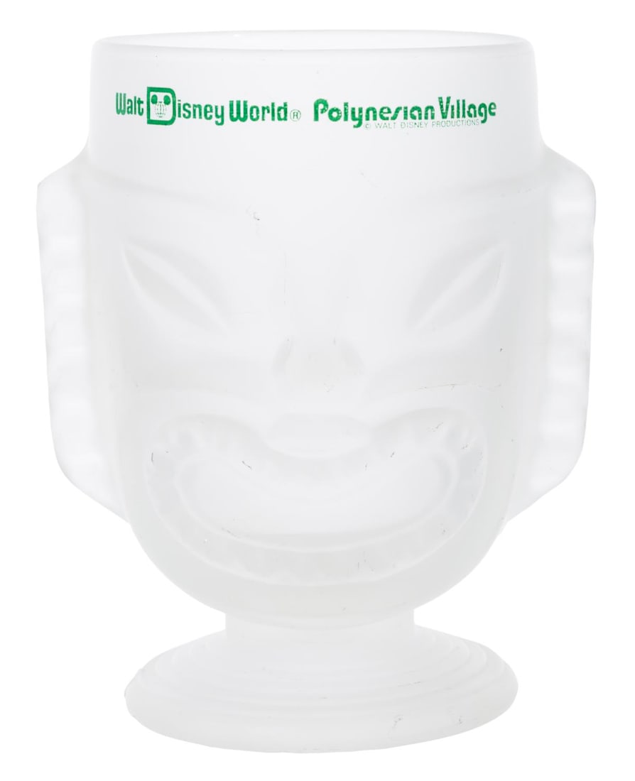 A Walt Disney World Polynesian Village Resort Mug.: (Disney's Polynesian Village Resort, 1970s) A large frosted tiki mug from Disney's Polynesian Village Resort. This mug was one of the earliest themed merchandise offered at the Resort. Measuring 6" ta