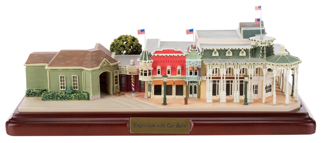 A First Edition Olszewski Walt Disney World Emporium with Car Barn.: (Olszewski, 2009) A rare First Edition Walt Disney World Emporium with Car Barn "Z" scale model by Robert Olszewski. This impressive hand-painted resin sculpture has a rotating feature to the barber s