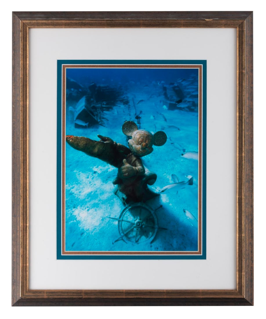 A Framed Castaway Cay Mickey Mouse Statue Print.: (Disney Cruise Line, 2000s) A framed print of the Mickey Mouse statue seen underwater at Castaway Cay, the Disney Cruise Line's private island in the Bahamas. With an image size of 10" x 13.5" in a