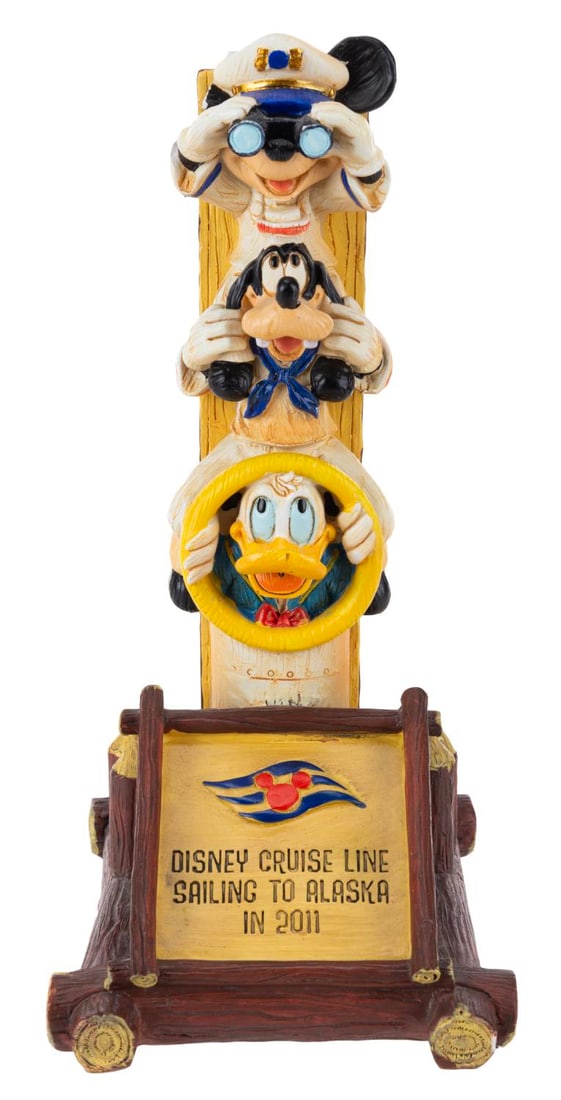 A 2011 Disney Cruise Line Alaska Sculpture.: (Disney Cruise Line, 2011) A totem pole sculpture commemorating Disney Cruise Line's expansion to Alaska in 2011. Measuring 5.25" x 4" x 8.5" tall, the sculpture is in good condition with Mickey's