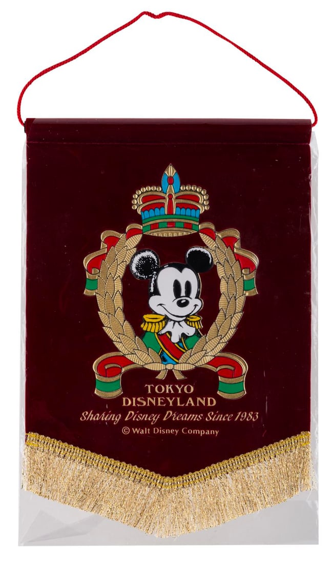 A Tokyo Disneyland Souvenir Banner.: (Tokyo Disneyland, 2000s) A small souvenir banner of Mickey Mouse from Tokyo Disneyland. Measuring 7" x 10.25", the banner is in fine condition.
