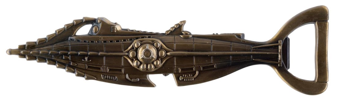 A Tokyo DisneySea Nautilus Bottle Opener.: (Tokyo DisneySea, 2000s) A figural bottle opener of the Nautilus from "20,000 Leagues Under the Sea," originally sold at Tokyo DisneySea. Measuring 6.5" long, the bottle opener is in very good