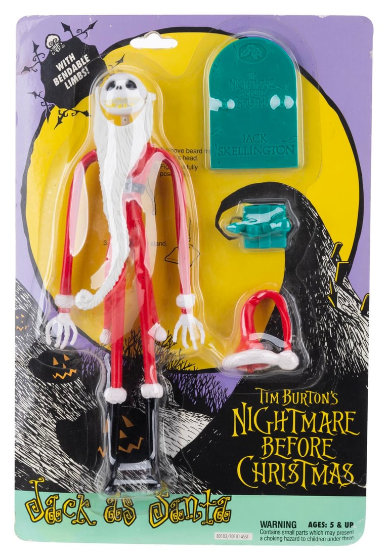 A Jack as Santa "Nightmare Before Christmas" Figure.: (Hasbro, 1993) An original release Hasbro "Nightmare Before Christmas" action figure of Jack sealed on a card, with a gravestone and a present accessory. Measuring 7.75" x 11.5" overall, the figure