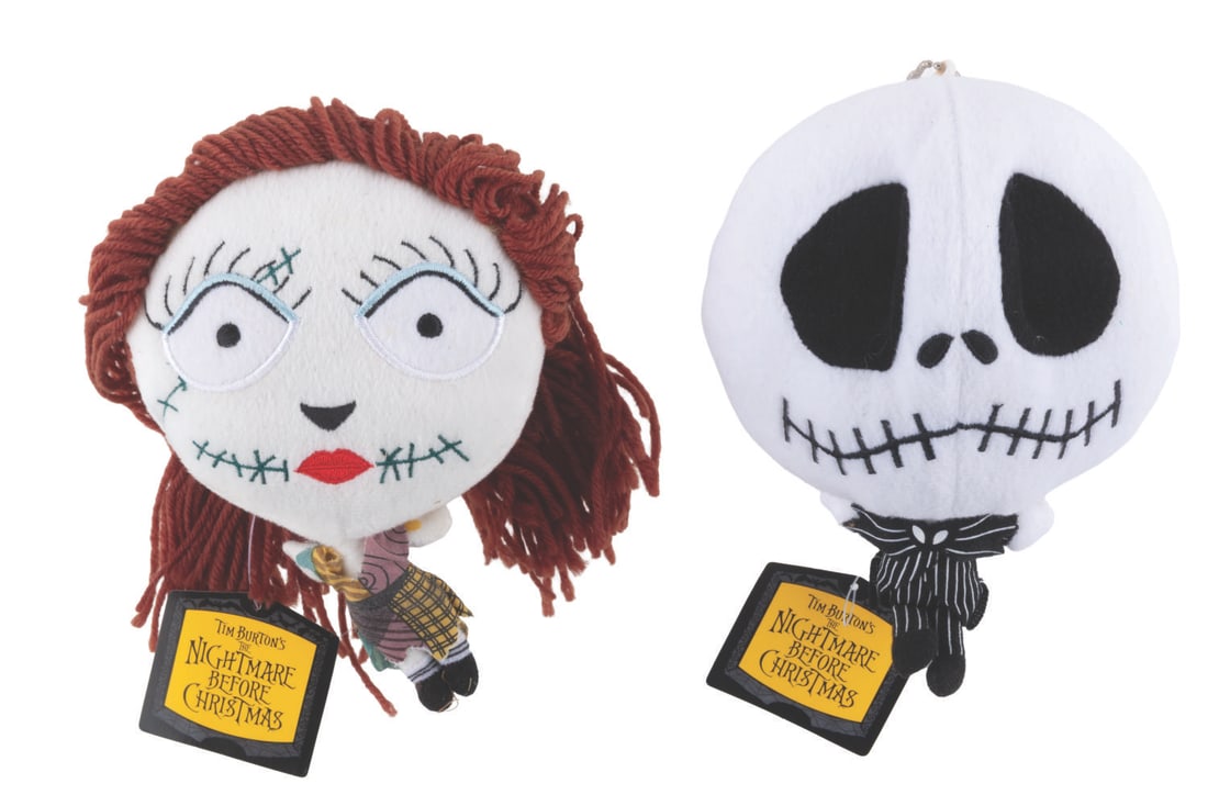 A Pair of Jack and Sally Head Plushes.: (NECA, 2005) A pair of chibi-style plushes of Jack Skellington and Sally from "The Nightmare Before Christmas," with big heads and tiny bodies. Measuring 7" tall each, the plush dolls are in fine