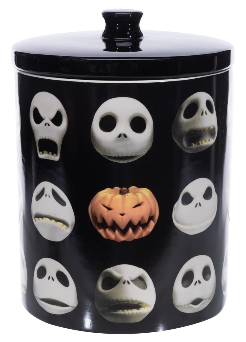 A Jack Skellington "Nightmare Before Christmas" Cookie Jar.: (Enesco, 2020s) A ceramic cookie jar featuring the many faces of Jack Skellington from "The Nightmare Before Christmas." Measuring 7" x 9" tall, the jar is in fine condition in its original box.