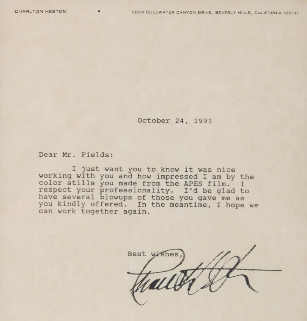 A Signed Letter from Charlton Heston.: (Heston, 1991) A signed letter from Charlton Heston to a "Mr. Fields," typed on Heston's personal stationery. Heston thanks Fields for providing color stills from the "Planet of the Apes" films and gr