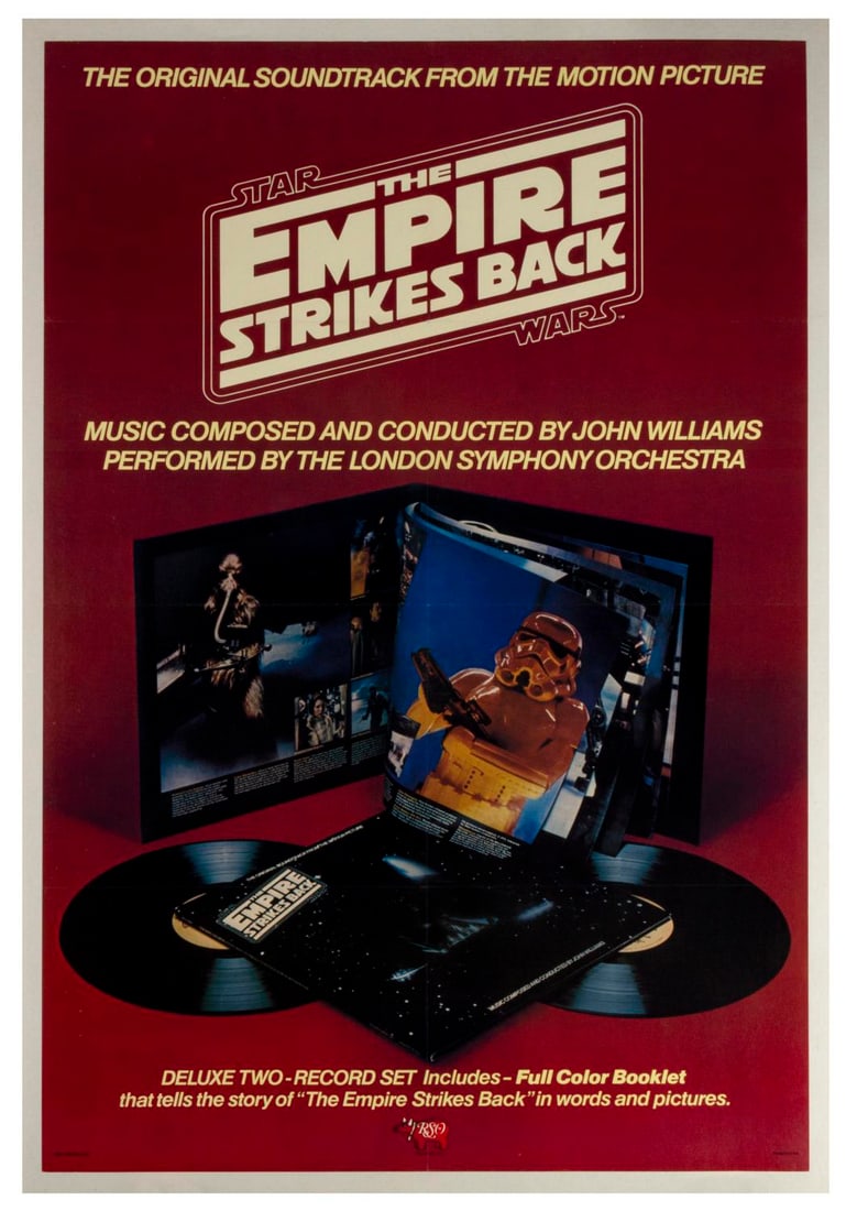 A "Star Wars: The Empire Strikes Back" RSO Soundtrack Poster.: (RSO Records, 1980) A poster for the deluxe 2-record soundtrack and story of the film for "The Empire Strikes Back," with music by John Williams. Measuring 24" x 36", the poster is in very good condit