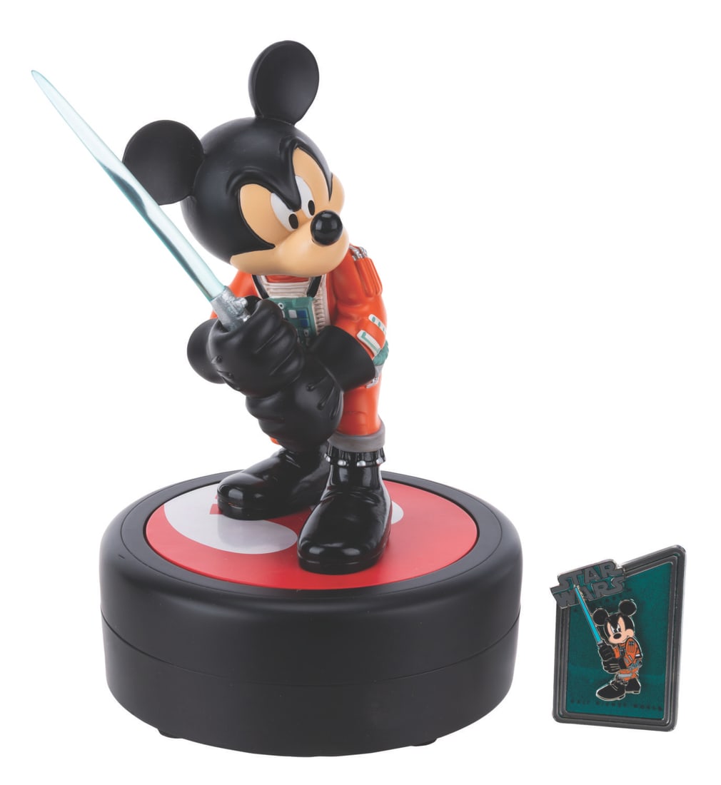 A Mickey Mouse as Luke Skywalker Medium Fig and Pin.: (Walt Disney World, 2011) A Medium Fig of Mickey Mouse as Luke Skywalker. Designed by Costa Alvezos, the figurine was released in a limited edition of 1977 exclusively at the 2011 Star Wars Weekends a
