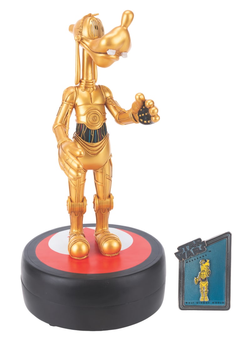 A Star Wars Weekend Goofy as C-3PO Medium Fig and Pin.: (Walt Disney World, 2013) A Medium Fig of Goofy as C-3PO. Designed by Costa Alvezos, the figurine was released in a limited edition of 1977 exclusively at the 2013 Star Wars Weekends at Walt Disney