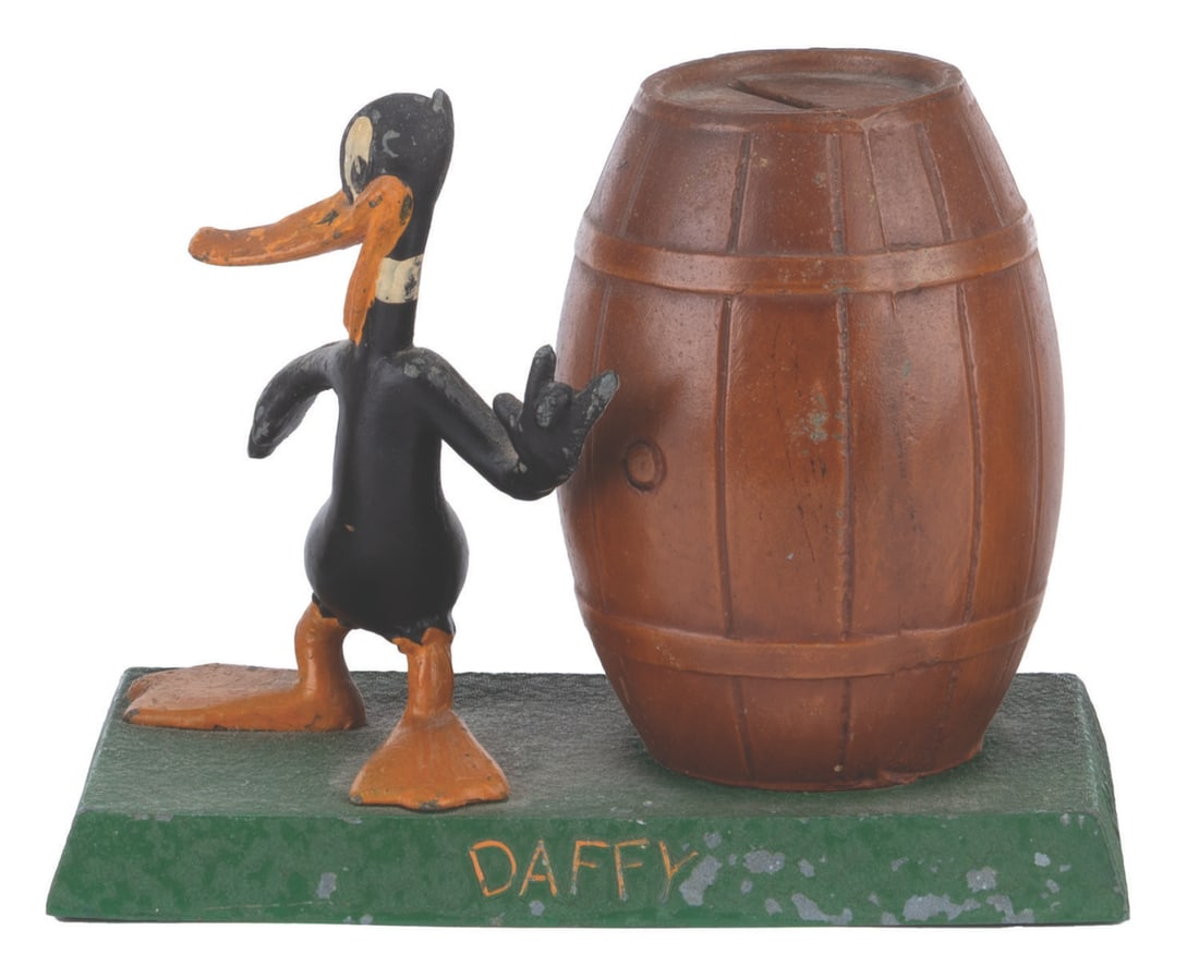A Daffy Duck Metal Coin Bank. (1 of 2)