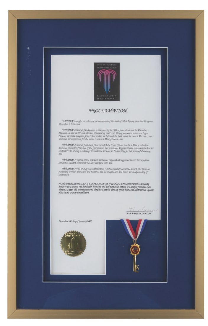 A Walt's 100th Birthday Proclamation & City Key Presented to Virginia Davis.: (Davis, 2002) A framed proclamation and key to Kansas City, Missouri, presented to Disney Legend Virginia Davis, star of Walt Disney's Alice Comedies. In celebration of Walt's 100th birthday, Mayor