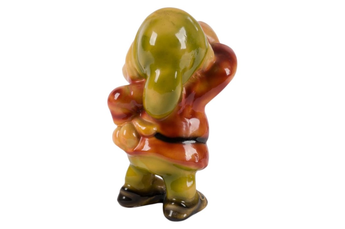 A Sneezy "Snow White" Figurine by Galligani.: (Galligani, 1930s-40s) A ceramic figurine of Sneezy from Walt Disney's "Snow White and the Seven Dwarfs," manufactured by Galligani of Norway. Measuring 3" x 3.25" and 5.5" tall, the figurine is in ve