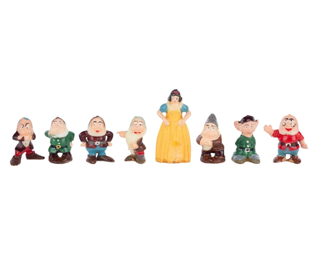 A "Snow White and the Seven Dwarfs" Disneykins Figurine Set.: (Marx, 1960s) A complete set of miniature figurines of "Snow White and the Seven Dwarfs." The figures measure approximately 1" tall each and are in very good condition with light wear from age and han