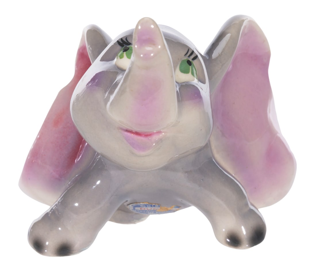 A "Dumbo" Ceramic Figurine.: (Modern Ceramic Products, 1950s) An adorable figurine of "Dumbo," manufactured by Modern Ceramic Products of Australia. Measuring 4.75" x 5.75" x 4.5" tall, the ceramic figurine displays in very good