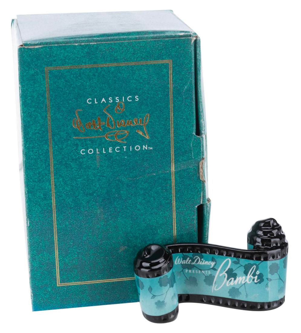 A WDCC "Bambi" Title Scroll.: (WDCC, 1991-2001) A "Bambi" opening title ceramic scroll from the Walt Disney Classics Collection. Measuring 2" x 3.25", the item is in fine condition.